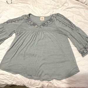 Knox Rose blue oversize flowy shirt with small cut it’s on arms. From Target XS